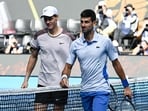 Italy's Jannik Sinner greets Serbia's Novak Djokovic. Italy's Jannik Sinner greets Serbia's Novak Djokovic.