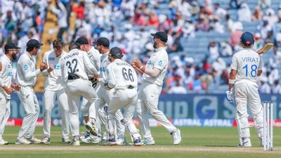 New Zealand's Mitchell Santner and teammates celebrate the wicket of India's Virat Kohli. (Surjeet Yadav) New Zealand's Mitchell Santner and teammates celebrate the wicket of India's Virat Kohli. (Surjeet Yadav)