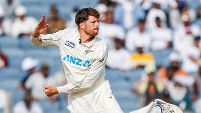 New Zealand's Mitchell Santner in action during Day 3 of the second test match against India, at Maharashtra Cricket Association Stadium in Pune on Saturday. (ANI ) New Zealand's Mitchell Santner in action during Day 3 of the second test match against India, at Maharashtra Cricket Association Stadium in Pune on Saturday. (ANI )