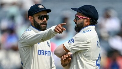 India's Virat Kohli talks with his captain Rohit Sharma (R). (AFP) India's Virat Kohli talks with his captain Rohit Sharma (R). (AFP)