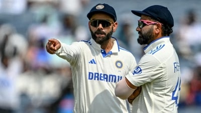 India's Virat Kohli talks with his captain Rohit Sharma (R) during the second day of the second Test cricket match between India and New Zealand (AFP) India's Virat Kohli talks with his captain Rohit Sharma (R) during the second day of the second Test cricket match between India and New Zealand (AFP)