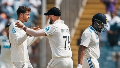 Mitchell Santner celebrates with Daryl Mitchell after taking the wicket of India's captain Rohit Sharma. (PTI) Mitchell Santner celebrates with Daryl Mitchell after taking the wicket of India's captain Rohit Sharma. (PTI)
