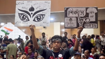 Kolkata: A person holds posters during a mass convention called by the West Bengal Junior Doctors Front, demanding justice for the alleged sexual assault and murder of a postgraduate trainee doctor, at R G Kar Medical College and Hospital, in Kolkata, Saturday, Oct 26, 2024. (PTI)