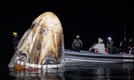 In this NASA handout, Support teams work around the SpaceX Dragon Endeavour spacecraft shortly after it landed with NASA astronauts Matthew Dominick, Michael Barratt, and Jeanette Epps, and Roscosmos cosmonaut Alexander Grebenkin aboard in the Gulf of Mexico off the coast of Pensacola, Florida on October 25, 2024. (Getty Images via AFP) In this NASA handout, Support teams work around the SpaceX Dragon Endeavour spacecraft shortly after it landed with NASA astronauts Matthew Dominick, Michael Barratt, and Jeanette Epps, and Roscosmos cosmonaut Alexander Grebenkin aboard in the Gulf of Mexico off the coast of Pensacola, Florida on October 25, 2024. (Getty Images via AFP)