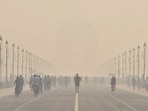 New Delhi, Oct 25 (ANI): Morning walkers, joggers and cyclists exercise on the Kartavya Path near India Gate amid deteriorating air quality in the city, in New Delhi on Sunday. (ANI Photo)