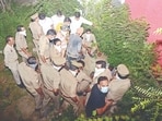 Officials exhuming the body near the residence of DM (HT) Officials exhuming the body near the residence of DM (HT)