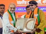 Amit Shah with party leader Mithun Chakraborty at the BJP's membership drive, in Kolkata. Amit Shah with party leader Mithun Chakraborty at the BJP's membership drive, in Kolkata.