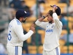 Rohit Sharma and Kuldeep Yadav during the fifth day of the first Test cricket match between India and New Zealand.