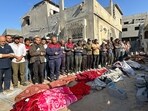 Palestinians pray over bodies of relatives, killed in an overnight Israeli airstrike, in Beit Lahia the northern Gaza Strip on October 27, 2024 amid the ongoing war in the Palestinian territory between Israel and Hamas. (Photo by AFP)