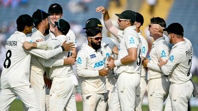 New Zealand players celebrate after their team's win against India. (Photo by Punit PARANJPE / AFP) / (AFP) New Zealand players celebrate after their team's win against India. (Photo by Punit PARANJPE / AFP) / (AFP)
