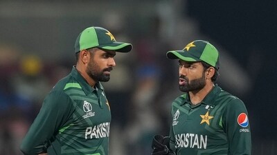 Pakistan's Babar Azam and Mohammad Rizwan talk during a match. (AP)