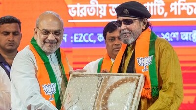 Amit Shah with party leader Mithun Chakraborty at the BJP's membership drive, in Kolkata. (PTI) Amit Shah with party leader Mithun Chakraborty at the BJP's membership drive, in Kolkata. (PTI)
