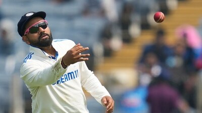 Rohit Sharma throws the ball during the day one of the second cricket Test match between India and New Zealand. (AP) Rohit Sharma throws the ball during the day one of the second cricket Test match between India and New Zealand. (AP)