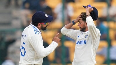 Rohit Sharma and Kuldeep Yadav during the fifth day of the first Test cricket match between India and New Zealand. (PTI)