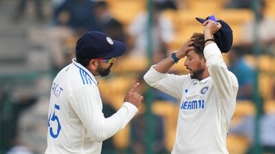 Rohit Sharma and Kuldeep Yadav during the fifth day of the first Test cricket match between India and New Zealand. (PTI)