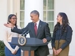 Former US President Barack Obama with daughters Sasha and Malia.