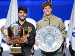 Carlos Alcaraz, left, of Spain poses with his trophy after winning against Jannik Sinner, right, of Italy during their men's singles finals match of the China Open. Carlos Alcaraz, left, of Spain poses with his trophy after winning against Jannik Sinner, right, of Italy during their men's singles finals match of the China Open.