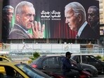 A billboard displaying world leaders after Israel's strike on Iran (Photo by ATTA KENARE / AFP)