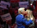 Former US President and Republican presidential candidate Donald Trump kisses former First Lady Melania Trump on stage during a campaign at Madison Square Garden in New York, October 27, 2024. (Photo by ANGELA WEISS / AFP)