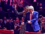 Republican presidential nominee and former U.S. President Donald Trump and Melania Trump gesture on stage during a campaign rally at Madison Square Garden, in New York, U.S., October 27, 2024. REUTERS/Brendan McDermid