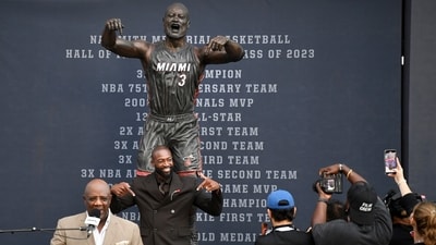 Former Miami Heat player Dwyane Wade, second from left, poses at his statue unveiling ceremony outside Kaseya Center, Sunday, Oct. 27, 2024, in Miami, Fla. (AP) Former Miami Heat player Dwyane Wade, second from left, poses at his statue unveiling ceremony outside Kaseya Center, Sunday, Oct. 27, 2024, in Miami, Fla. (AP)
