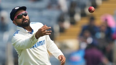 Rohit Sharma throws the ball during the day one of the second cricket Test match between India and New Zealand. (AP) Rohit Sharma throws the ball during the day one of the second cricket Test match between India and New Zealand. (AP)