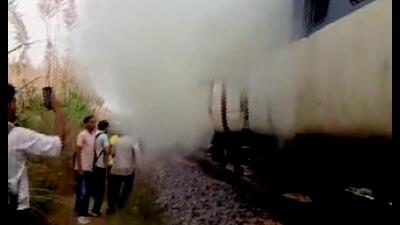 Smoke billows out after an explosion in a passenger train in Rohtak district on Monday. (PTI)