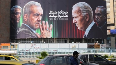 A billboard displaying world leaders after Israel's strike on Iran (Photo by ATTA KENARE / AFP) (AFP) A billboard displaying world leaders after Israel's strike on Iran (Photo by ATTA KENARE / AFP) (AFP)