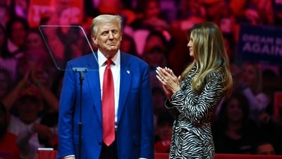 Former US First Lady Melania Trump applauds her husband former US President and Republican presidential candidate Donald Trump after he spoke at a campaign rally at Madison Square Garden in New York, October 27, 2024. (AFP) Former US First Lady Melania Trump applauds her husband former US President and Republican presidential candidate Donald Trump after he spoke at a campaign rally at Madison Square Garden in New York, October 27, 2024. (AFP)