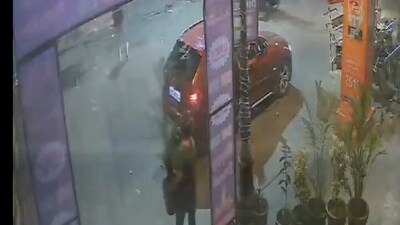 A woman in Noida stole a flower pot from a residential society while driving a BMW (Sachin Gupta/X)