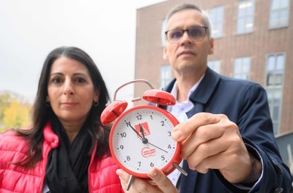 Daniela Cavallo (L), Chairwoman of the General and Group Works Council of the Volkswagen Group, and Thorsten Groeger (R), negotiator of the IG Metall metalworkers union, hold an alarm clock as they pose for a photo as employees of German car maker Volkswagen (VW) attend an information event by workers' representatives focusing on their management's latest savings proposals,. (AFP) Daniela Cavallo (L), Chairwoman of the General and Group Works Council of the Volkswagen Group, and Thorsten Groeger (R), negotiator of the IG Metall metalworkers union, hold an alarm clock as they pose for a photo as employees of German car maker Volkswagen (VW) attend an information event by workers' representatives focusing on their management's latest savings proposals,. (AFP)