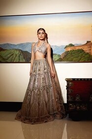 Outfit: Ruchika Hurria
The actor cements her glamour credentials in Ruchika Hurria‘s powder pink net lehenga in silk with pearls, sequins and Swarovski embroidery, paired with a halter neck blouse with crystal and pearl embellishments, including an ombre net dupatta. The look is rounded off with a statement maang tikka from Sahai Ambar Pariddi Outfit: Ruchika Hurria
The actor cements her glamour credentials in Ruchika Hurria‘s powder pink net lehenga in silk with pearls, sequins and Swarovski embroidery, paired with a halter neck blouse with crystal and pearl embellishments, including an ombre net dupatta. The look is rounded off with a statement maang tikka from Sahai Ambar Pariddi