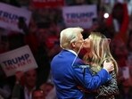Former US President and Republican presidential candidate Donald Trump kisses former First Lady Melania Trump on stage during a campaign at Madison Square Garden in New York, October 27, 2024. (Photo by ANGELA WEISS / AFP)