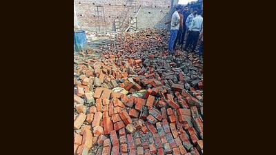 A 60-foot wall came down at an under-construction plastic factory in Focal Point Phase 7, Ludhiana, on Tuesday. (Gurpreet Singh/HT)