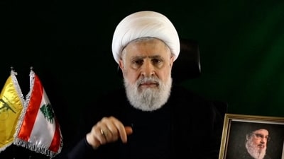An image grab taken from Hezbollah's Al-Manar TV shows Naim Qassem delivering a speech from an undisclosed location. (AFP)