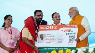 Prime Minister Narendra Modi with Union minister of health and family welfare JP Nadda hands over an 'Ayushman Vaya Vandana Card' to a beneficiary during an event, at All India Institute of Ayurveda (AIIA) in New Delhi on Tuesday. (ANI) Prime Minister Narendra Modi with Union minister of health and family welfare JP Nadda hands over an 'Ayushman Vaya Vandana Card' to a beneficiary during an event, at All India Institute of Ayurveda (AIIA) in New Delhi on Tuesday. (ANI)