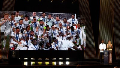 Didier Drogba with Sandy Heribert present club men team of the year to Real Madrid (REUTERS)