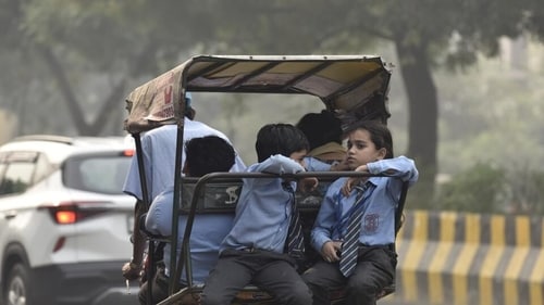 Children return home from school amid rising air pollution, in Noida. The Gautam Budh Nagar Parents Welfare Society has written to the district administration requesting them to make masks mandatory for school students in order to safeguard them from hazardous gases due to pollution. (Photo by Sunil Ghosh / Hindustan Times) Children return home from school amid rising air pollution, in Noida. The Gautam Budh Nagar Parents Welfare Society has written to the district administration requesting them to make masks mandatory for school students in order to safeguard them from hazardous gases due to pollution. (Photo by Sunil Ghosh / Hindustan Times)