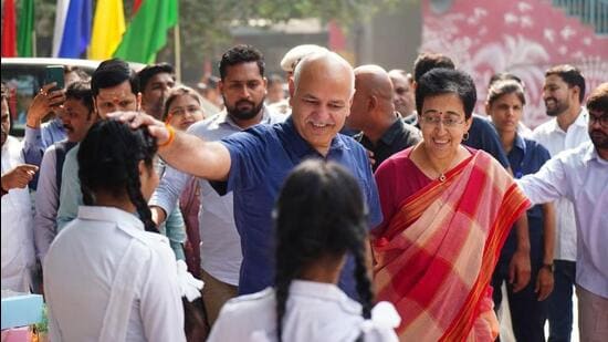 Atishi and Manish Sisodia at the event. (HT Photo)
