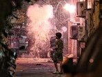 Children burst crackers on the eve of Diwali at Old Rajendra Nagar in New Delhi, on Wednesday. (Sanchit Khanna/HT photo)