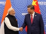 Indian Prime Minister Narendra Modi shakes hands with Chinese President Xi Jinping before their meeting on the sidelines of the Brics summit in Kazan, Russia, on October 23. (Reuters)