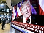FILE - An image of President-elect Donald Trump appears on a television screen on the floor of the New York Stock Exchange, Nov. 9, 2016. (AP Photo/Richard Drew, File) FILE - An image of President-elect Donald Trump appears on a television screen on the floor of the New York Stock Exchange, Nov. 9, 2016. (AP Photo/Richard Drew, File)