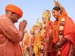 Ayodhya: Uttar Pradesh chief minister Yogi Adityanath greets artists dressed as Lord Rama, Lord Lakshmana and Goddess Sita. Ayodhya: Uttar Pradesh chief minister Yogi Adityanath greets artists dressed as Lord Rama, Lord Lakshmana and Goddess Sita.