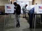 Voters fill out their ballots for the presidential election during early voting in Detroit,  Michigan.