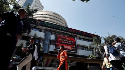 Marico share price: People walk past the Bombay Stock Exchange (BSE) building in Mumbai, India, March 9, 2020. (Francis Mascarenhas/Reuters)