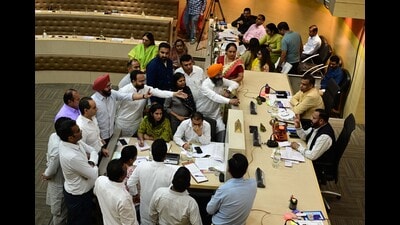 BJP councillors protesting after AAP councillor Prem Lata made a personal remark on nominated councillor Geeta Chauhan during the MC House meeting in Chandigarh on Tuesday. (Keshav Singh/HT) BJP councillors protesting after AAP councillor Prem Lata made a personal remark on nominated councillor Geeta Chauhan during the MC House meeting in Chandigarh on Tuesday. (Keshav Singh/HT)