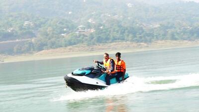 Himachal CM Sukhvinder Sukhu taking a jet ski ride after inaugurating water sports project at the Govind Sagar Lake in Bilaspur. (HT Photo)