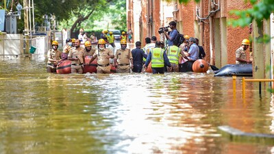 National Disaster Response Force (NDRF) personnel evacuate the residents of Kendriya Vihar from a flooded area in Bengaluru. (Pic for representation) (PTI) National Disaster Response Force (NDRF) personnel evacuate the residents of Kendriya Vihar from a flooded area in Bengaluru. (Pic for representation) (PTI)
