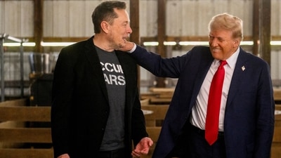 Elon Musk, chief executive officer of Tesla Inc., left, and former US President Donald Trump, prior to a campaign event at the Butler Farm Show in Butler, Pennsylvania, US. (Bloomberg)