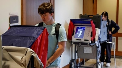 Students cast their ballots as they take advantage of early voting in the 2024 election at a the University of Wisconsin. (AFP) Students cast their ballots as they take advantage of early voting in the 2024 election at a the University of Wisconsin. (AFP)